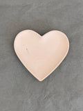 Heart-shaped object on a Grey background
