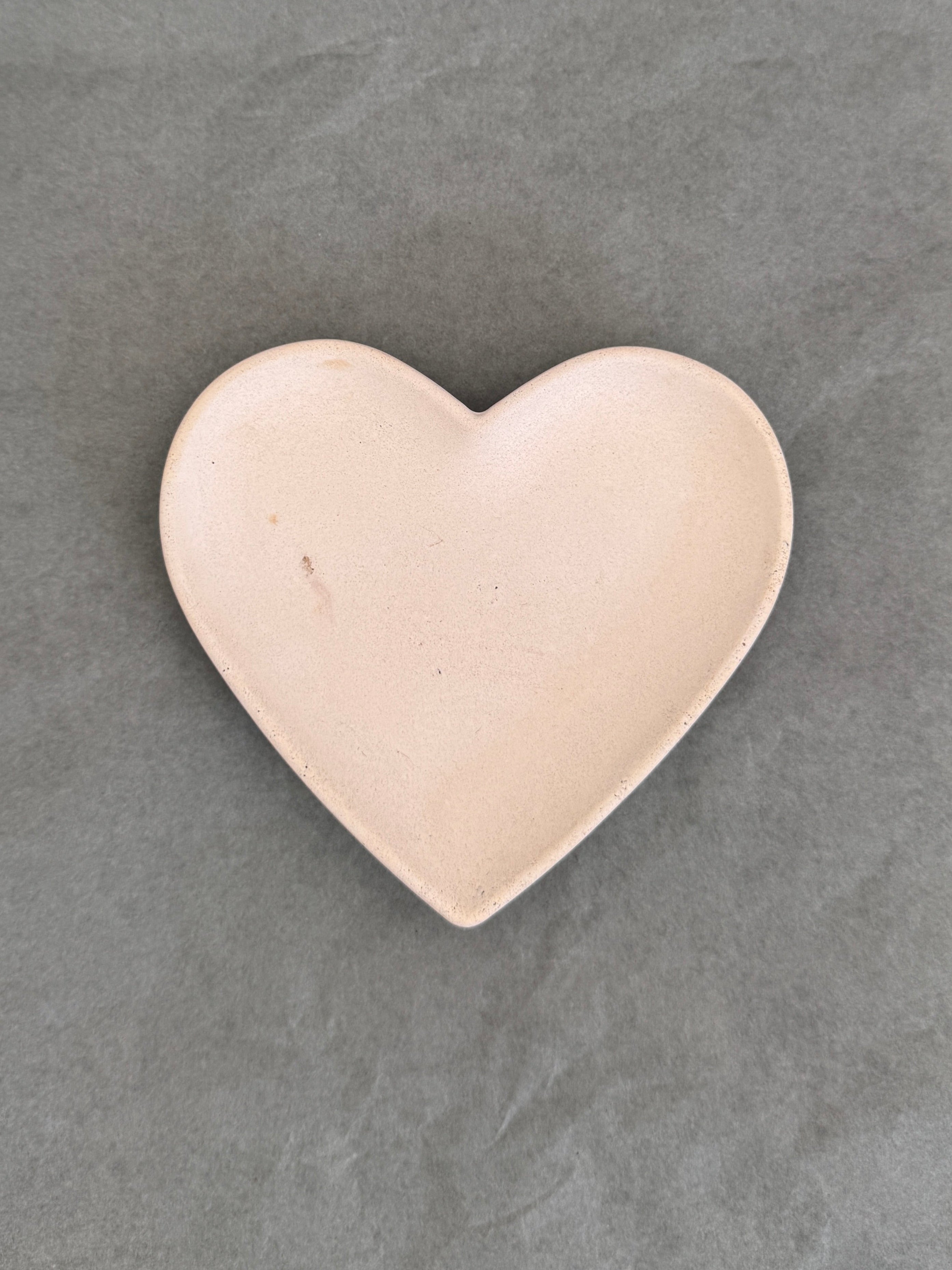 Heart-shaped object on a Grey background
